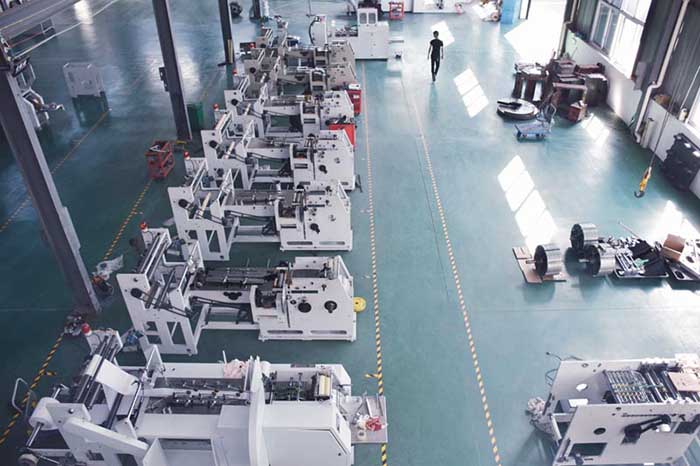 Modern paper bag production facility with multiple fully automatic paper bag machines in operation